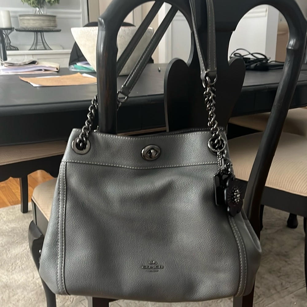 NWOTCoach gorgeous grey leatherwith gunmetal hardware. Black flower charm.